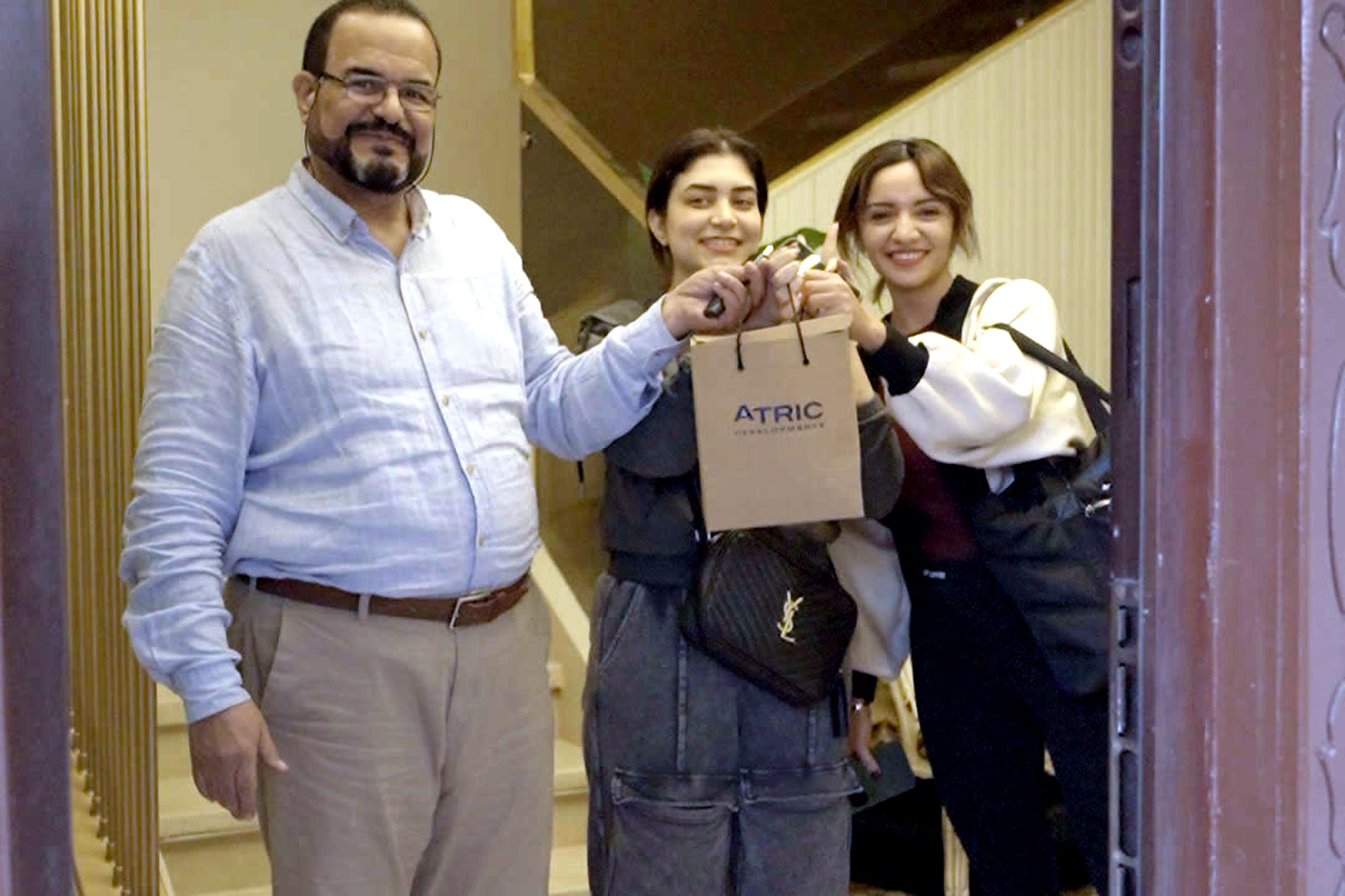 A Divina Gardens family receiving an ATRIC Christmas gift
