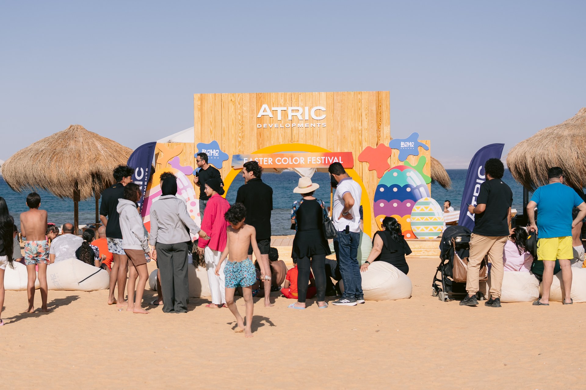 Families gathering by the festival stage on BOHO Sokhna beach