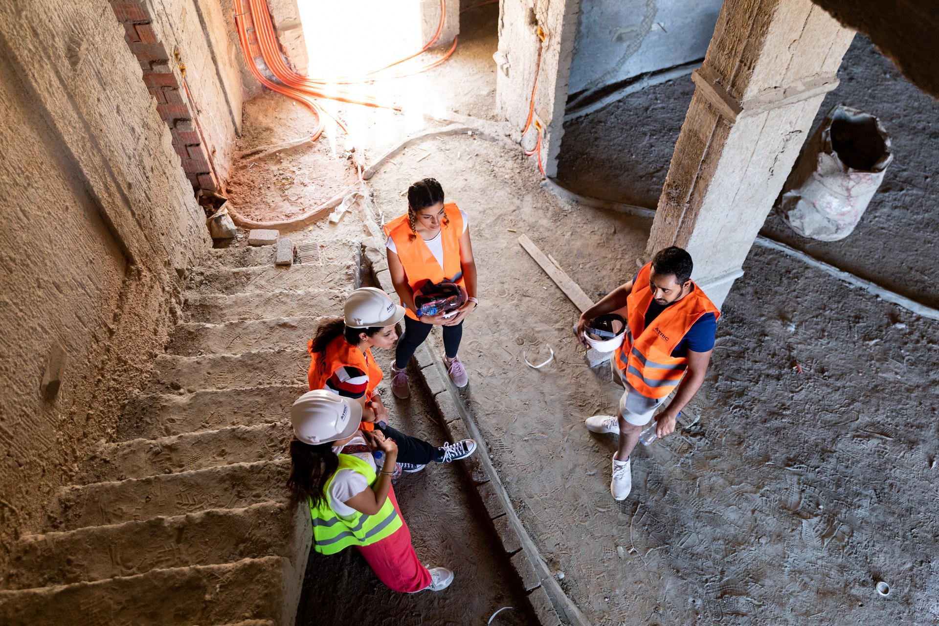 Students moving through a BOHO Sokhna building under construction